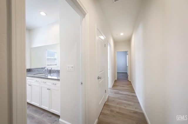 8412 Jean Anne St, Bakersfield, CA 93314 - corridor with light wood finished floors and recessed lighting