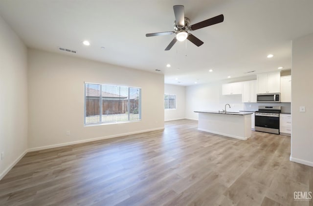 8412 Jean Anne St, Bakersfield, CA 93314 - unfurnished living room with recessed lighting, light wood-style flooring, and a ceiling fan