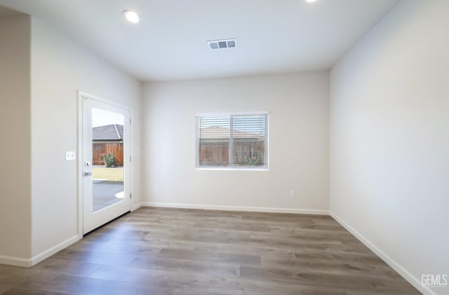 8412 Jean Anne St, Bakersfield, CA 93314 - empty room with plenty of natural light, recessed lighting, and wood finished floors