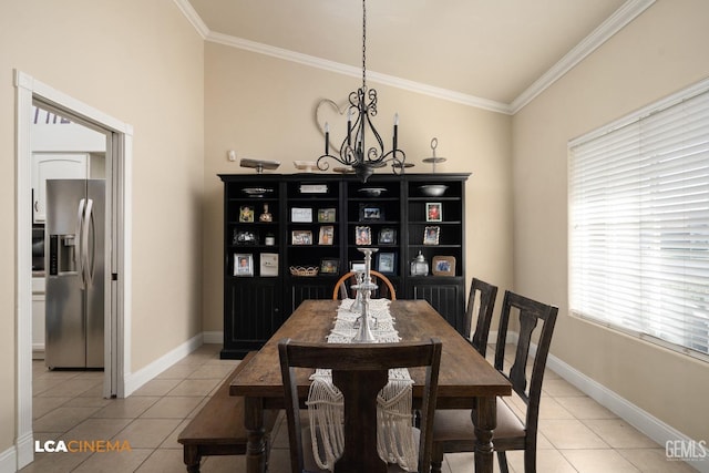 dining room with ornamental molding, light tile patterned floors, and a notable chandelier