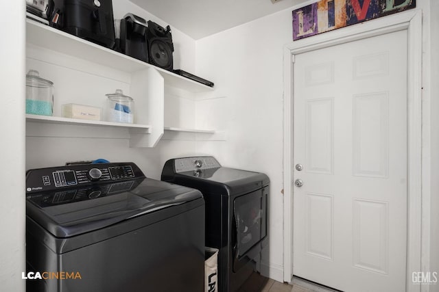 washroom featuring washer and dryer