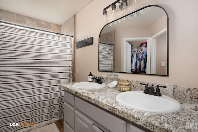 bathroom with a shower with curtain and vanity