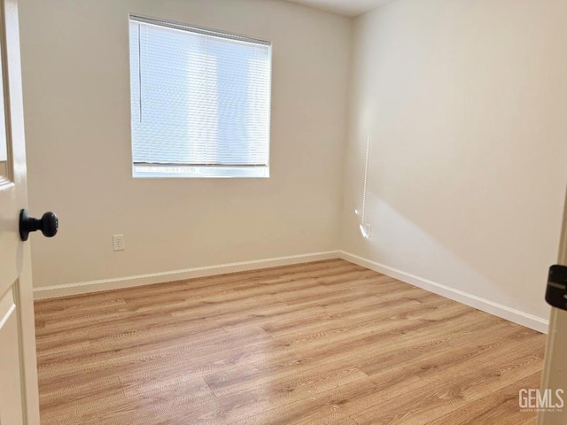 5717 Arc Dome Ave, Bakersfield, CA 93313 - unfurnished room featuring wood finished floors and baseboards