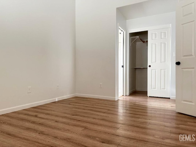 5717 Arc Dome Ave, Bakersfield, CA 93313 - unfurnished bedroom featuring wood finished floors and a closet