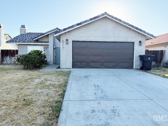 5717 Arc Dome Ave, Bakersfield, CA 93313 - ranch-style home featuring a garage, concrete driveway, stucco siding, and a chimney