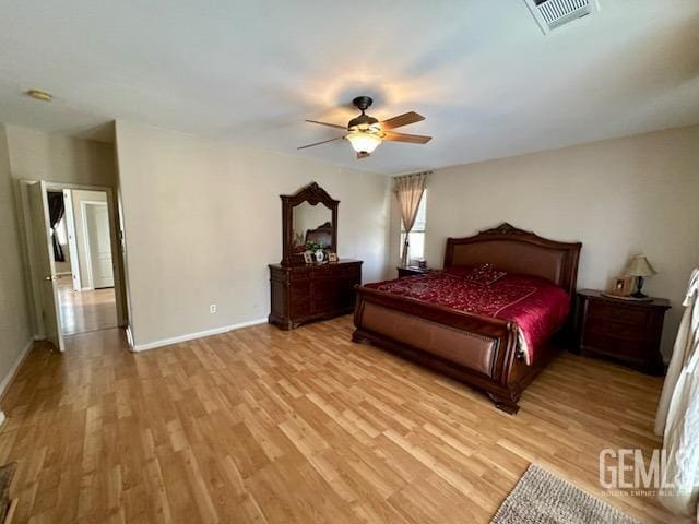 bedroom with light wood-type flooring, visible vents, ceiling fan, and baseboards