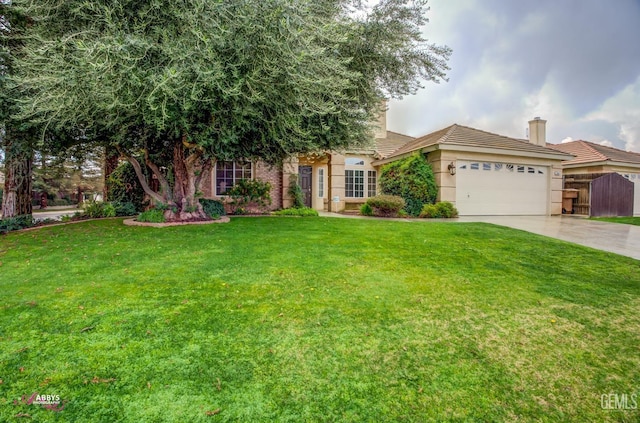 view of front of house featuring a garage and a front lawn