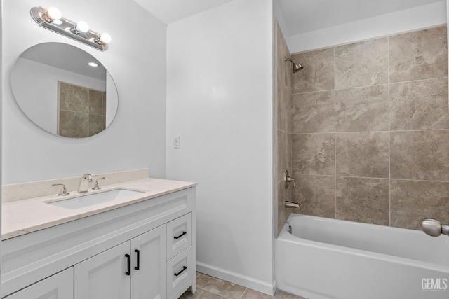 bathroom with vanity, tiled shower / bath combo, and tile patterned flooring