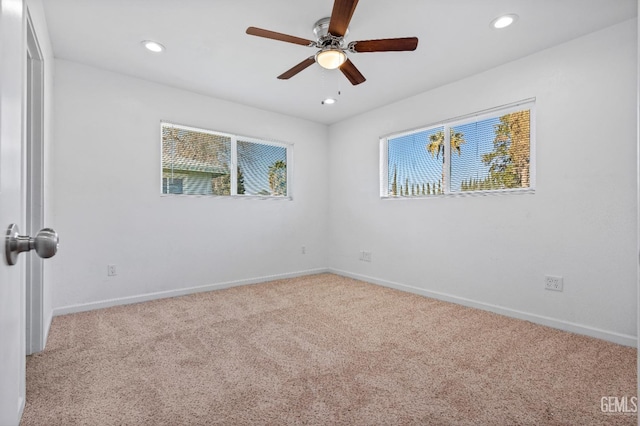 carpeted empty room with ceiling fan