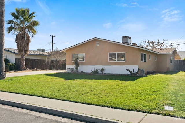 exterior space featuring a front yard and central air condition unit