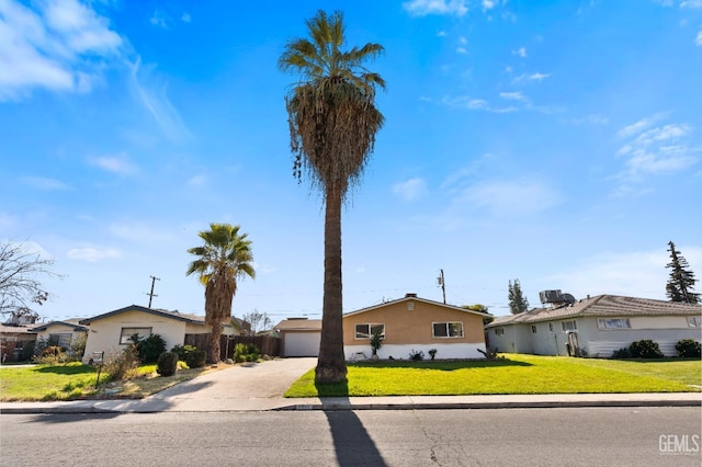 ranch-style house featuring a garage and a front yard