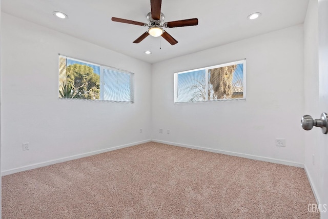 carpeted empty room with ceiling fan