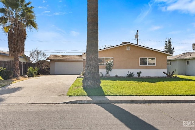 ranch-style house with a garage and a front yard