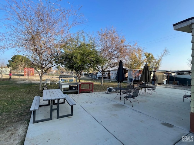 view of home's community with a patio and fence