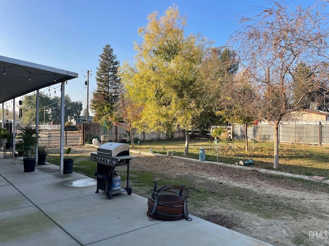 exterior space with fence and area for grilling