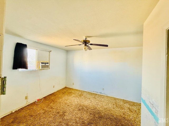 spare room featuring ceiling fan, carpet, and cooling unit