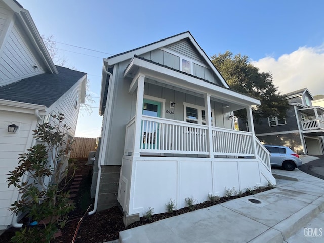 5929 Gran Paseo Way, Atascadero, CA 93422 - view of front facade with a porch, fence, and board and batten siding