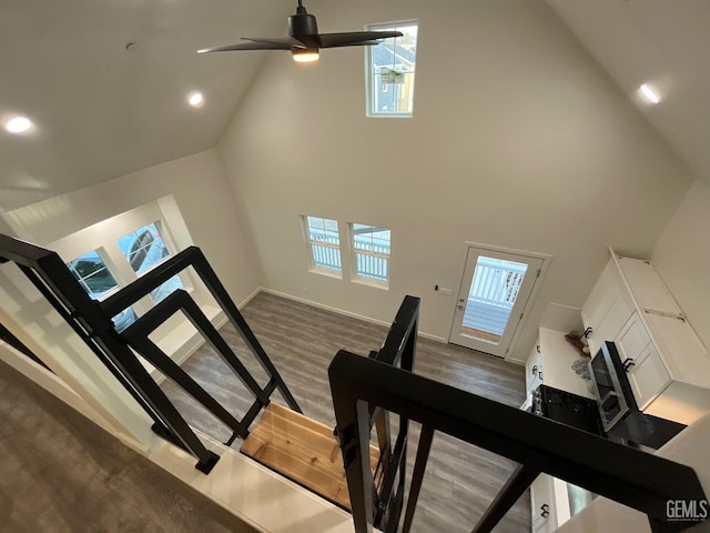 5929 Gran Paseo Way, Atascadero, CA 93422 - staircase with baseboards, recessed lighting, a ceiling fan, wood finished floors, and high vaulted ceiling