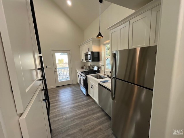 5929 Gran Paseo Way, Atascadero, CA 93422 - kitchen with white cabinets, stainless steel appliances, a sink, dark wood-style flooring, and high vaulted ceiling