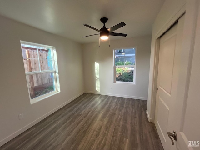 5929 Gran Paseo Way, Atascadero, CA 93422 - unfurnished bedroom with baseboards, a ceiling fan, dark wood-style floors, and a closet