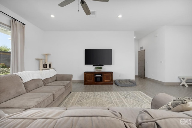 living area featuring light wood finished floors, visible vents, and recessed lighting