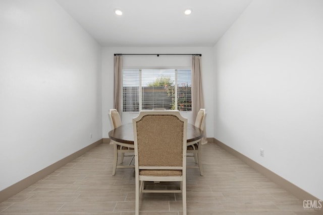 dining room featuring recessed lighting, wood tiled floor, and baseboards