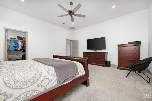 bedroom featuring recessed lighting, a closet, light colored carpet, visible vents, and a spacious closet