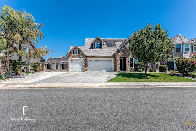 view of front of home with a front yard and solar panels