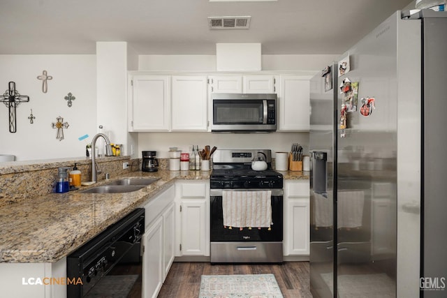 10006 Grand View Summit Dr, Bakersfield, CA 93311 - kitchen featuring appliances with stainless steel finishes, a peninsula, and white cabinets