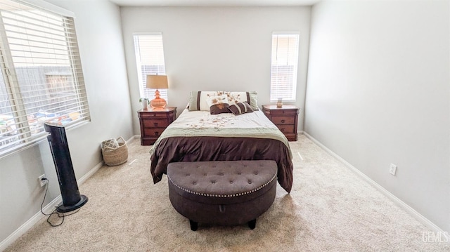 bedroom with carpet flooring and baseboards