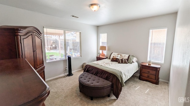 bedroom featuring baseboards, visible vents, and carpet floors