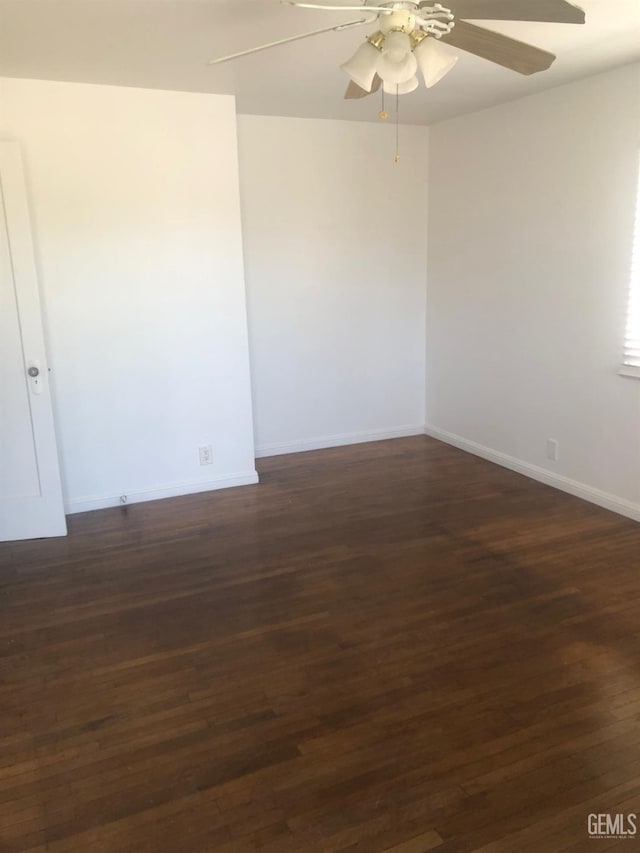 1543 Sycamore Dr, Wasco, CA 93280 - empty room with a ceiling fan, baseboards, and dark wood-type flooring