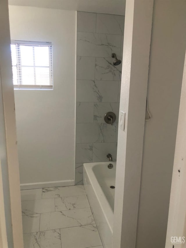 1543 Sycamore Dr, Wasco, CA 93280 - bathroom featuring marble look tile flooring,  shower combination, and baseboards