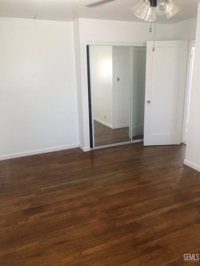 1543 Sycamore Dr, Wasco, CA 93280 - empty room with a ceiling fan, baseboards, and dark wood-type flooring