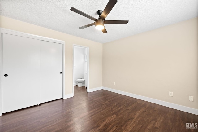 2605 Bladen St, Bakersfield, CA 93309 - unfurnished bedroom featuring dark wood finished floors, a closet, a textured ceiling, a ceiling fan, and connected bathroom