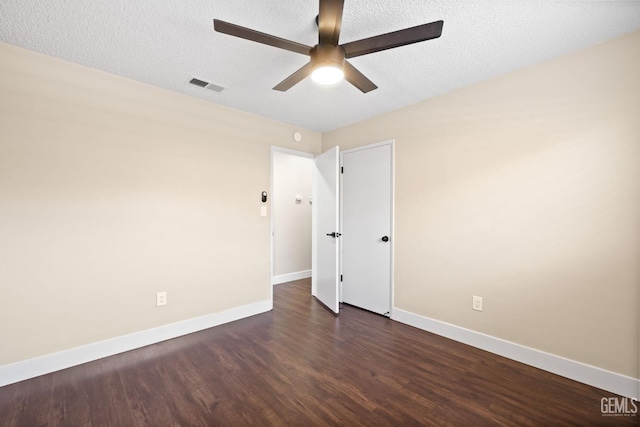 2605 Bladen St, Bakersfield, CA 93309 - unfurnished room featuring a ceiling fan, dark wood finished floors, and a textured ceiling
