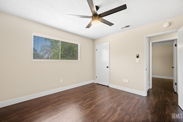 2605 Bladen St, Bakersfield, CA 93309 - unfurnished bedroom with a textured ceiling, dark wood finished floors, and a ceiling fan