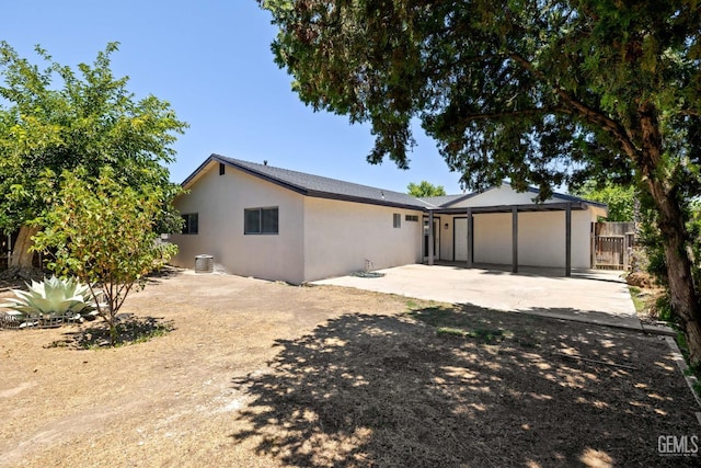 2605 Bladen St, Bakersfield, CA 93309 - rear view of house with stucco siding and a patio