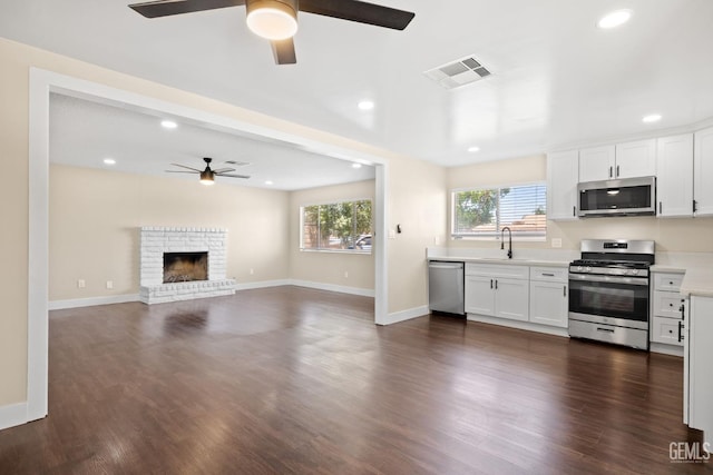 2605 Bladen St, Bakersfield, CA 93309 - kitchen with stainless steel appliances, a ceiling fan, recessed lighting, light countertops, and white cabinetry