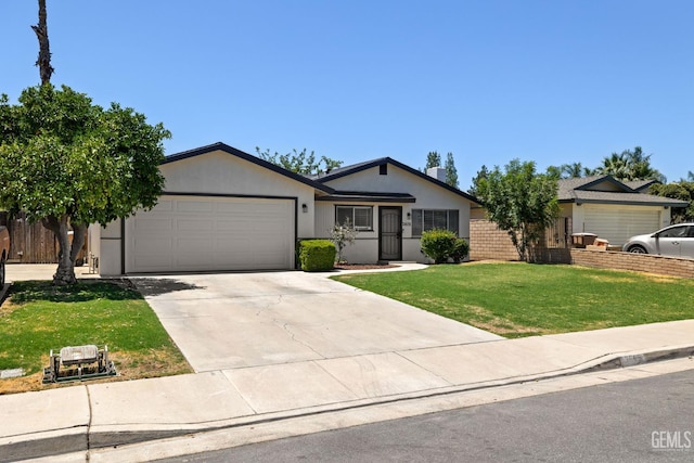 2605 Bladen St, Bakersfield, CA 93309 - ranch-style house with a garage, a front yard, concrete driveway, and stucco siding