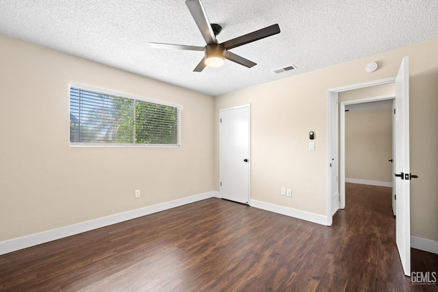 2605 Bladen St, Bakersfield, CA 93309 - unfurnished bedroom with a textured ceiling, dark wood finished floors, and ceiling fan