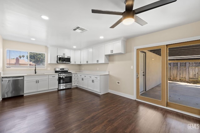 2605 Bladen St, Bakersfield, CA 93309 - kitchen featuring appliances with stainless steel finishes, light countertops, white cabinetry, and recessed lighting