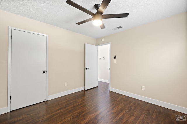 2605 Bladen St, Bakersfield, CA 93309 - unfurnished bedroom with dark wood-style floors, a textured ceiling, and a ceiling fan
