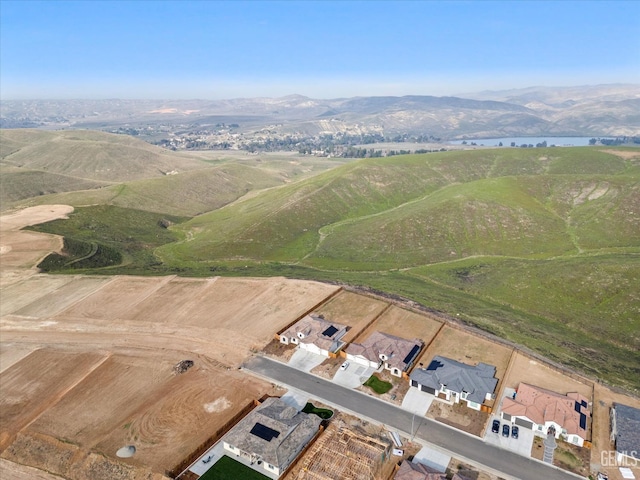 birds eye view of property with a mountain view and a rural view