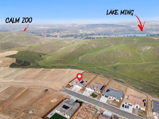 drone / aerial view featuring a mountain view and a rural view