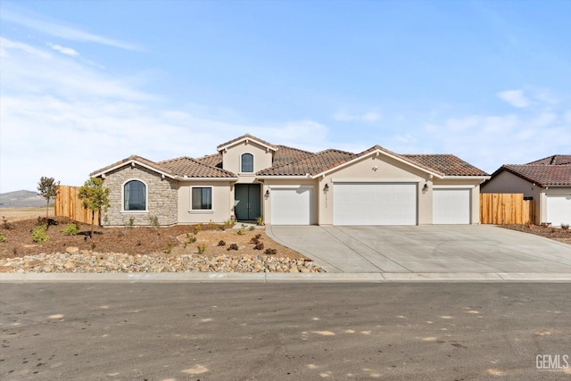 mediterranean / spanish-style home featuring a garage