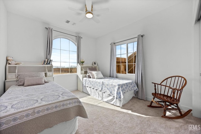 carpeted bedroom featuring ceiling fan