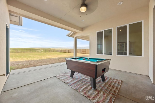 view of patio featuring ceiling fan