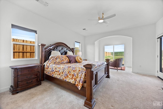 bedroom featuring light colored carpet and ceiling fan