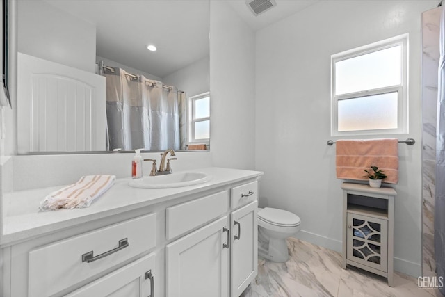 bathroom with vanity and toilet